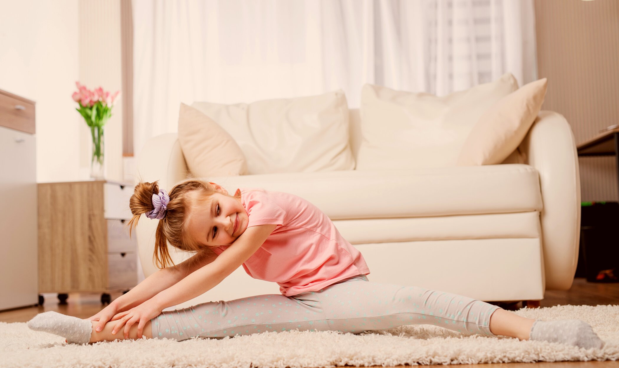 Child doing stretches at home